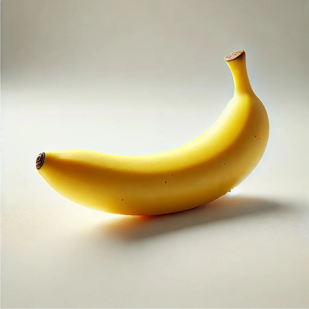 Close-up of a medium-sized banana resting on a kitchen countertop